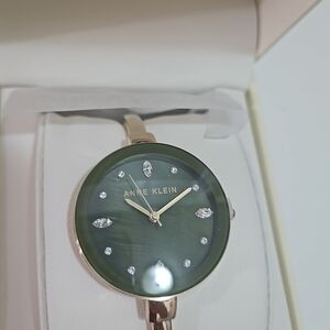 Anne Klein Gold-Tone Bangle Watch with Green Mother-of-Pearl Dial